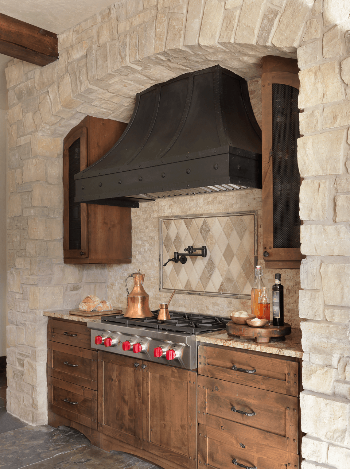 Rustic Kitchen with Custom Range Hood and Unique Tile